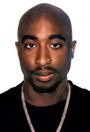 A passport image of Tupac Shakur looking straight into the camera with a serious face.